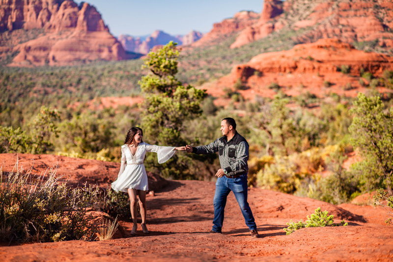 dancing in the desert for bride and groom photos