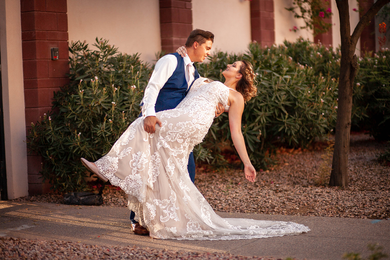 Groom dips bride during Arizona wedding