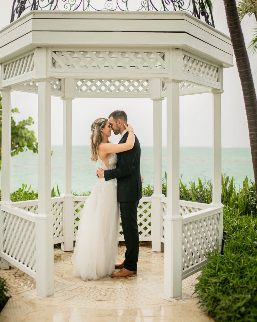 bride and groom under gazebo at turks and caicos