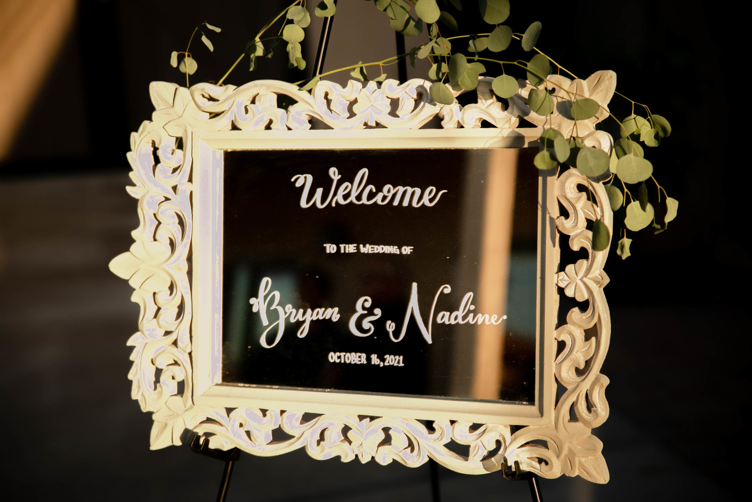 sign saying welcome to bride and grooms wedding